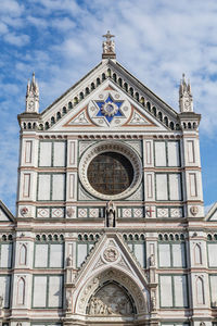 Low angle view of ornate building against sky