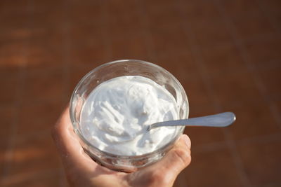 Close-up of person holding glass