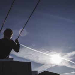 Boy playing against sky