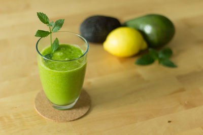 Close-up of smoothie with fruits served on table