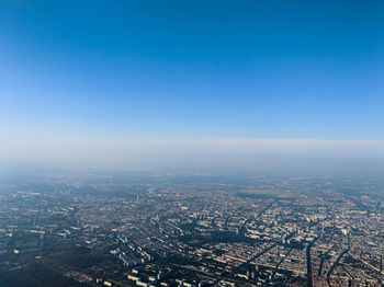 High angle view of city against clear blue sky