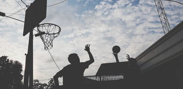 Low angle view of basketball hoop against sky