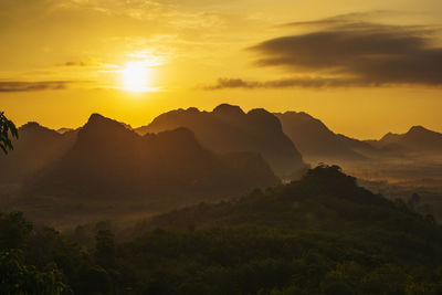 Scenic view of mountains against sky during sunset