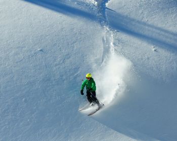 Full length of man skiing on snow