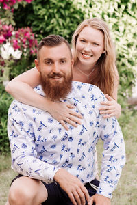 Portrait of smiling young couple in park