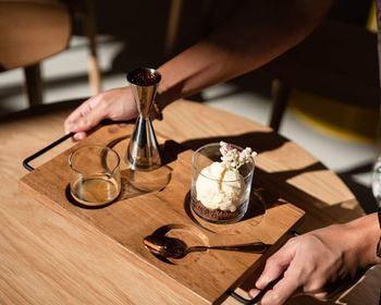 Cropped hand of woman having breakfast