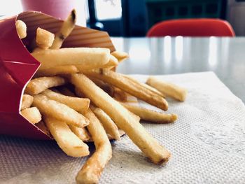 Close-up of fries with vegetables on table