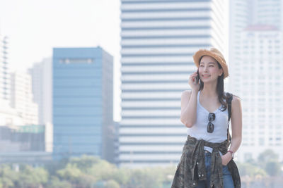 Young woman standing outdoors