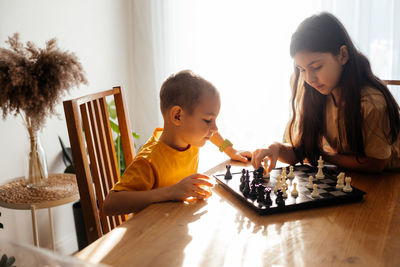 Boys playing on table