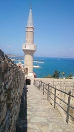 Scenic view of sea by building against sky