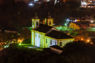 High angle view of illuminated buildings at night