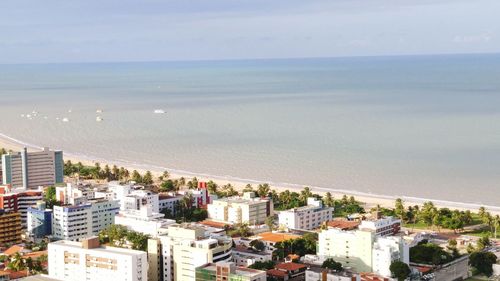 View of cityscape with sea in background