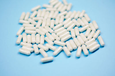 Close-up of blue buttons against white background
