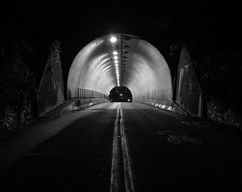 View of illuminated tunnel at night