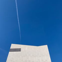 Low angle view of building against blue sky