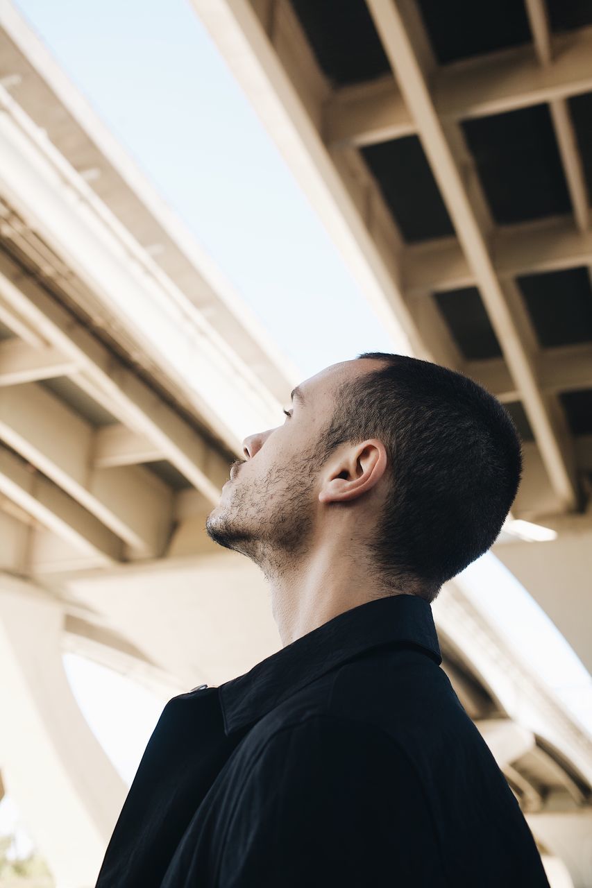 one person, built structure, architecture, real people, lifestyles, men, young men, headshot, building exterior, portrait, low angle view, beard, young adult, leisure activity, looking, focus on foreground, looking away, side view, standing, outdoors, ceiling, contemplation