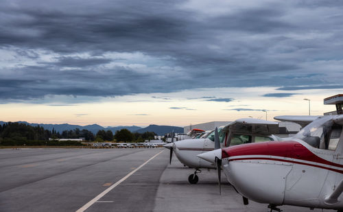 Airplane on runway against sky