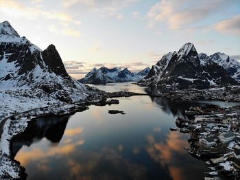 Scenic view of snowcapped mountains against sky during sunset