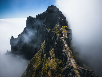 Aerial view at exposed footpath on pico do arieiro above clouds, madeira, portugal