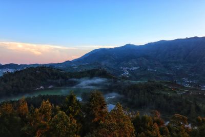 Scenic view of mountains against sky during sunset