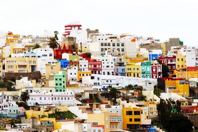 High angle view of buildings in city against clear sky