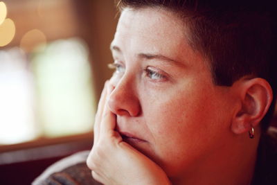 Close-up of thoughtful woman looking away