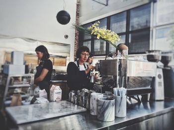 People sitting in kitchen