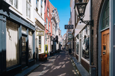 Street amidst buildings against sky