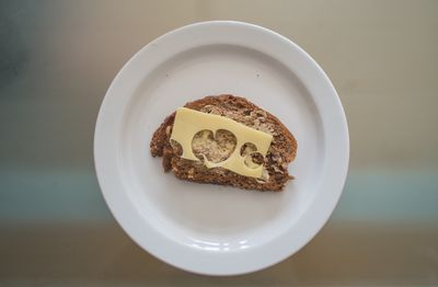 Close-up overhead view of cake and bread in plate