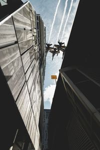 Low angle view of buildings against sky in city