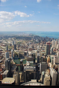High angle view of modern buildings in city against sky
