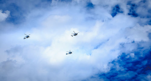 Low angle view of airplane flying against sky