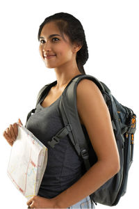 Portrait of a smiling young woman against white background