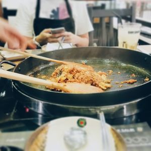 Close-up of cropped hand holding food