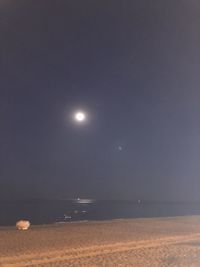 Scenic view of sea against sky at night