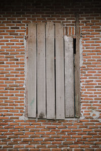 Window on brick wall of building