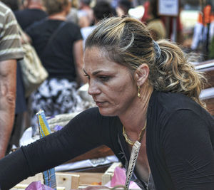 Portrait of woman drinking outdoors