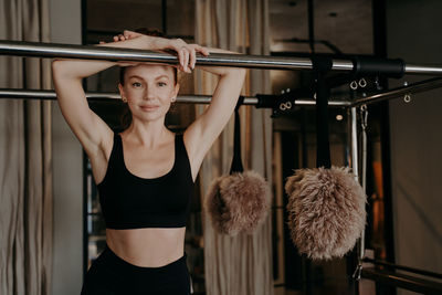 Portrait of woman standing at gym