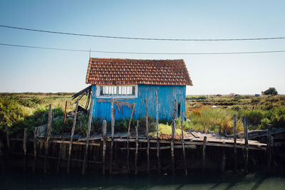 Abandoned house against clear sky