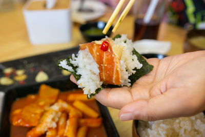 Close-up of hand holding food