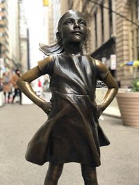Statue of woman in city