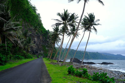 Road by sea against sky