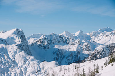 Scenic view of snowcapped mountains against sky