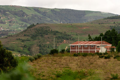 Scenic view of landscape and mountains against sky