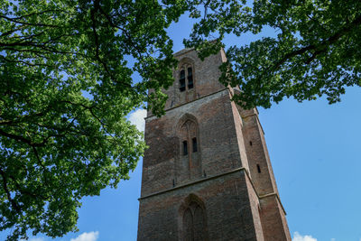 Low angle view of bell tower against sky