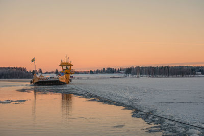 Scenic view of sea against clear sky during sunset