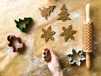 Cropped image of hand making cookies