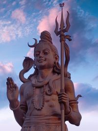 Low angle view of statue against sky