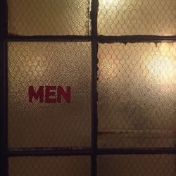 Close-up of illuminated text on wall