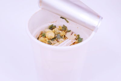 Close-up of food in bowl against white background